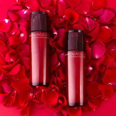 DeAGE Red Addition Skin Toner and Emulsion on rose petals